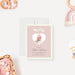 Blush pink baby announcement card with a heart-shaped photo cutout, personalized with the baby’s name and birth details.-front
