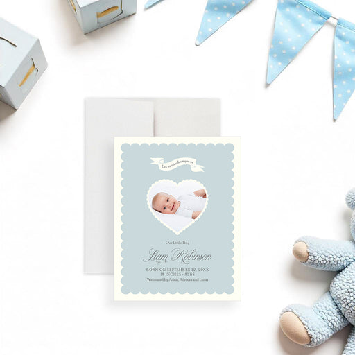 Personalized baby announcement card in pastel blue, featuring a heart-shaped newborn photo and custom birth details, perfect for keepsakes and gifts.-front