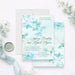 Personalized aqua watercolor greenery wedding invitation with leafy botanical design, custom couple’s names, wedding date and venue-front-back