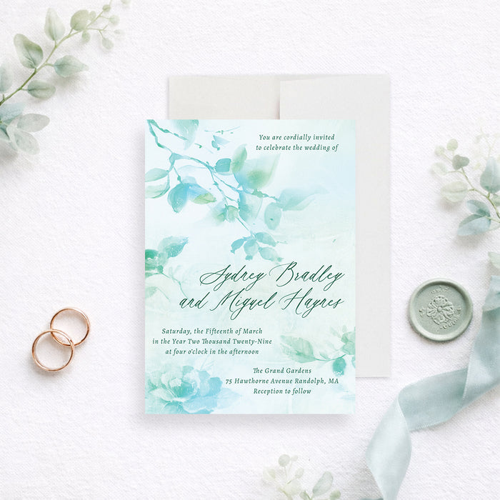 Personalized aqua watercolor greenery wedding invitation with leafy botanical design, custom couple’s names, wedding date and venue-front