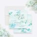 Front and back of personalized aqua watercolor greenery wedding save the date card with custom couple’s names, wedding date and leafy botanical design-front-back