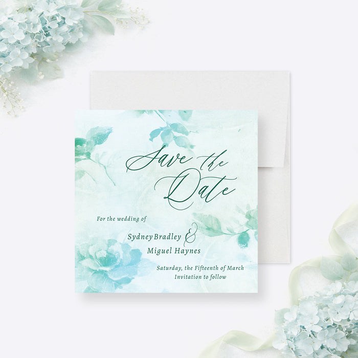 Front and back of personalized aqua watercolor greenery wedding save the date card with custom couple’s names, wedding date and leafy botanical design-front