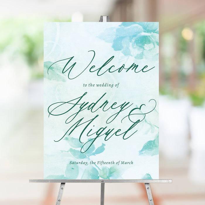 Personalized aqua watercolor greenery wedding welcome sign with leafy botanical design, custom couple’s names and wedding date