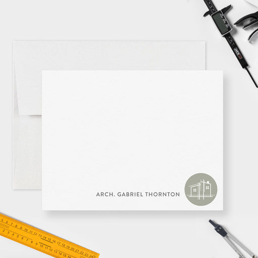 Personalized architect note card with a name and white building drawing inside a muted green circle at the lower right on white.