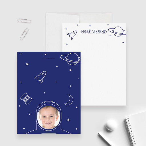 Astronaut photo note cards with a name, rocket and planet on the white front; navy space back with a child’s photo in the astronaut helmet.