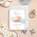 Personalized neutral beige and light blue cloud baby boy birth announcement card with newborn photo, name, birth date, weight, length, arrival time, and parents' names-front