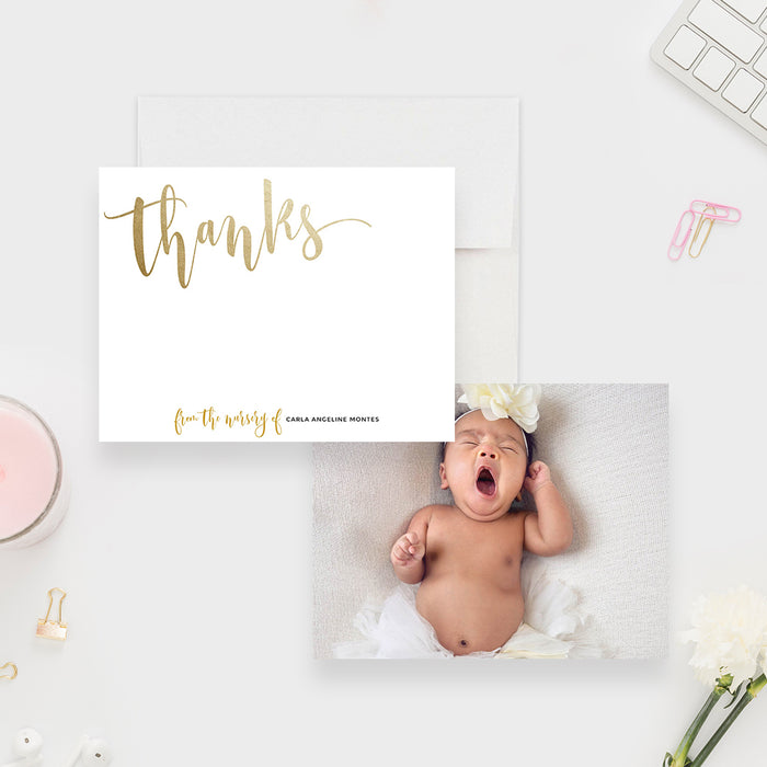 White baby thank you note card with gold-colored script, beside the back featuring a baby photo.