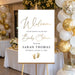 Personalized baby shower welcome sign with A Little Miracle Is on the Way wording, honoree’s name, event date and baby footprints