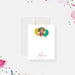 White personalized birthday note card with a child's photo inside a colorful balloon design and a script name below.