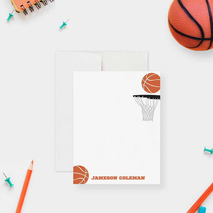 Personalized basketball thank you card with orange basketballs, a hoop and net, and a name along the bottom of the white front.