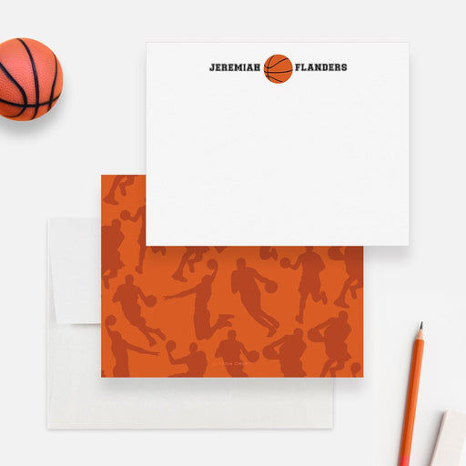 Personalized basketball note cards with a basketball between the first and last name on white and an orange player silhouette pattern on the back.