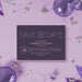 Modern personalized Bat Mitzvah save the date card with plum purple background, Star of David, and custom event details-front