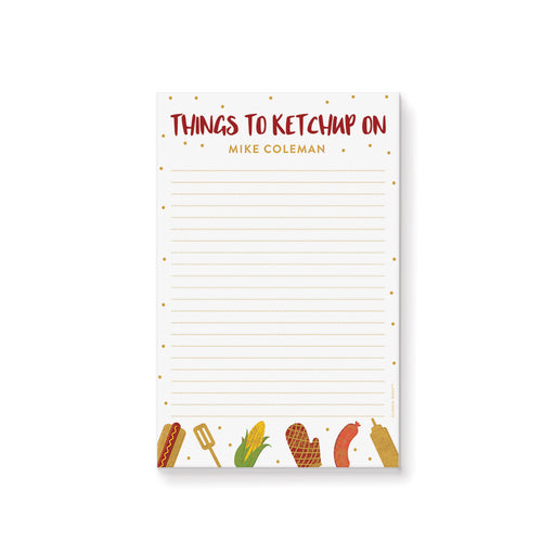 Personalized lined BBQ notepad with Things to Ketchup On heading, custom name, hot dog, corn, sausage, grill mitt, spatula and mustard illustrations