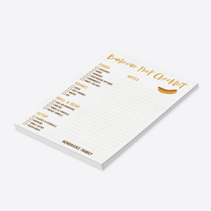 Personalized BBQ prep checklist notepad with sections for food, drinks, grill and gear, setup, lined notes, hot dog illustration and family name-side