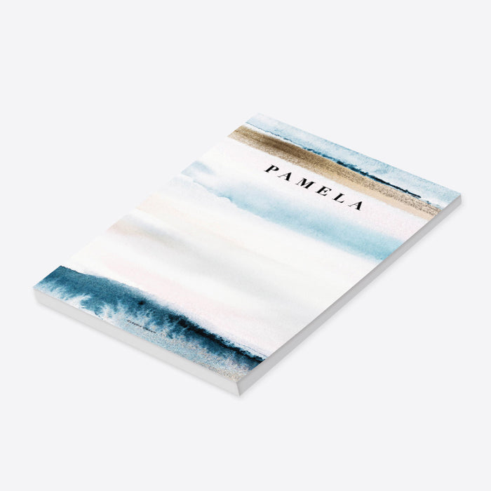 personalized beach notepad with blue ocean wave artwork, sand-toned accents, soft coastal colors, and custom name-side