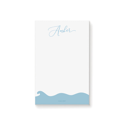 Personalized notepad with hand-drawn blue ocean waves at the bottom, custom stationery for beach weddings