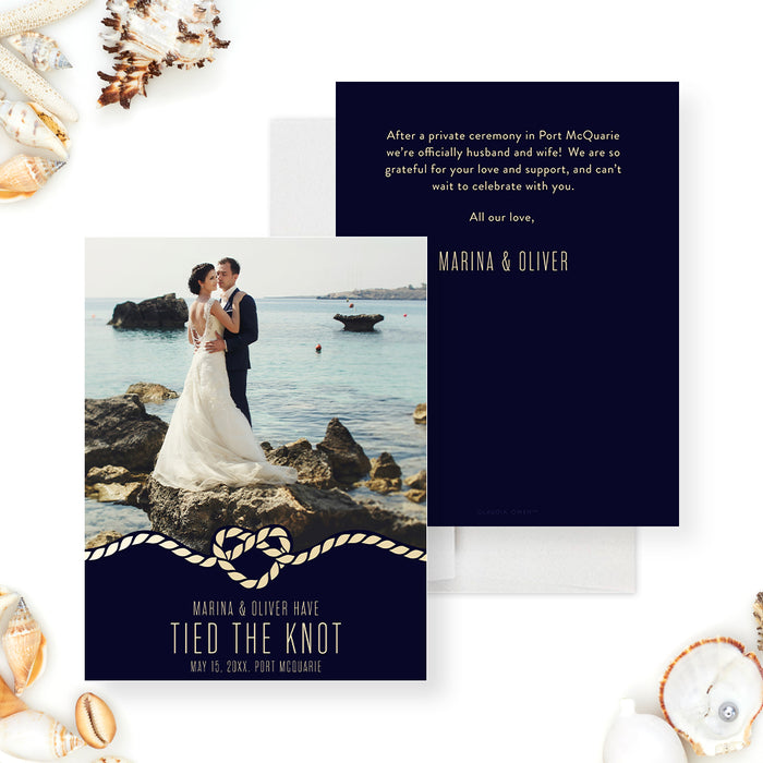 Personalized wedding announcement card with a couple’s photo, rope heart detail, and navy blue background