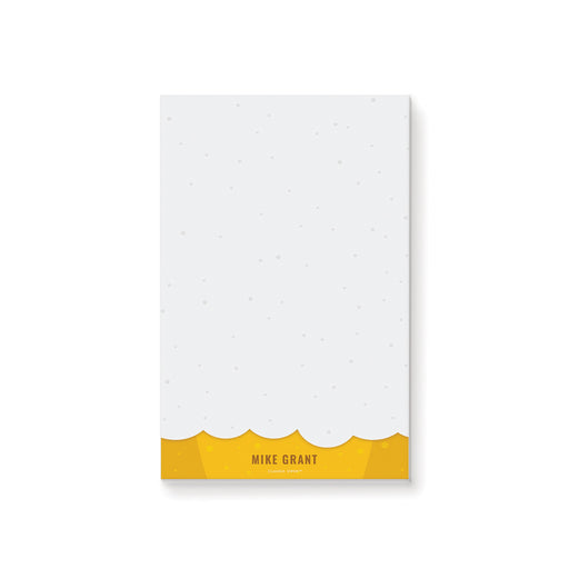 Personalized beer lover notepad with a white writing area, golden yellow beer and foam design, and a name at the bottom