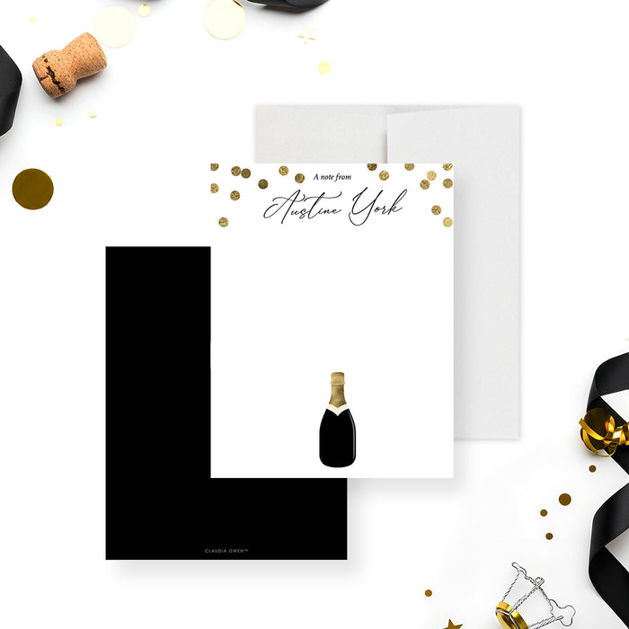 personalized thank you card with gold confetti accents, custom name in elegant script, champagne bottle illustration, and blank space for handwritten notes-front-back