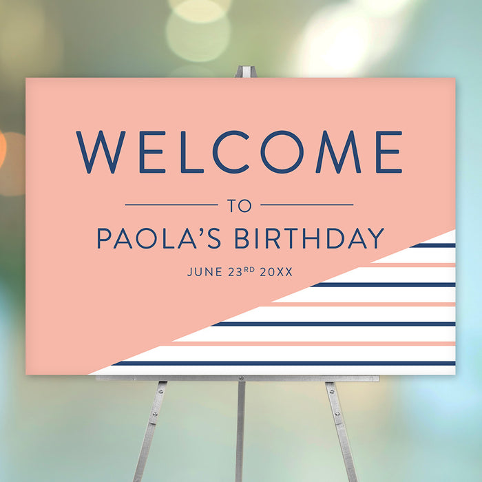Personalized birthday party welcome sign with peach background, navy blue and peach stripes, honoree’s name and celebration date