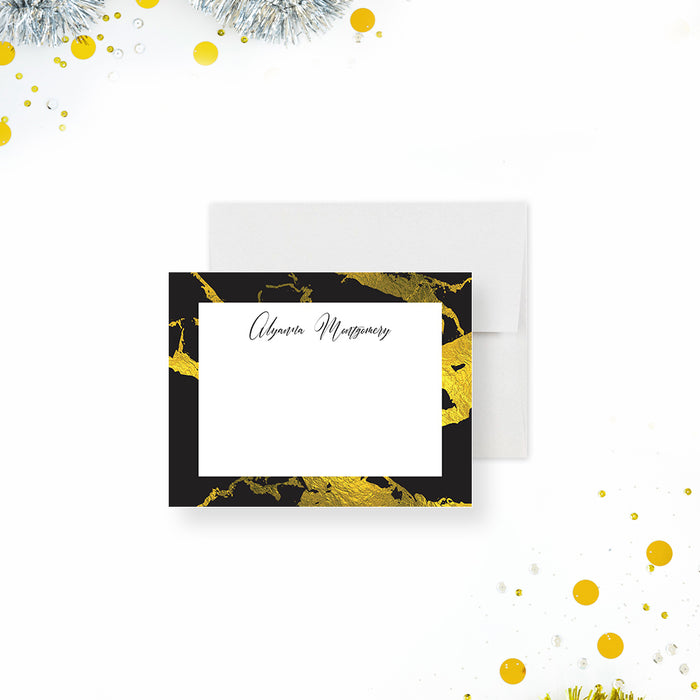 Personalized note card with a white front framed by a black and printed gold marble border with a personalized name. Shown with a white envelope.