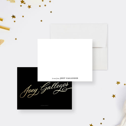 Personalized white note cards with a small name on the writing front and printed gold calligraphy lettering on the black reverse.
