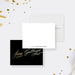 Personalized white note cards with a small name on the writing front and printed gold calligraphy lettering on the black reverse.