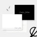 Personalized black and white note cards with a script name on the white writing front and black reverse.