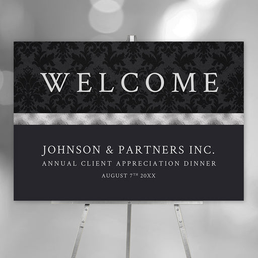 Personalized black corporate client appreciation dinner welcome sign with damask pattern, Johnson and Partners company name and annual event date
