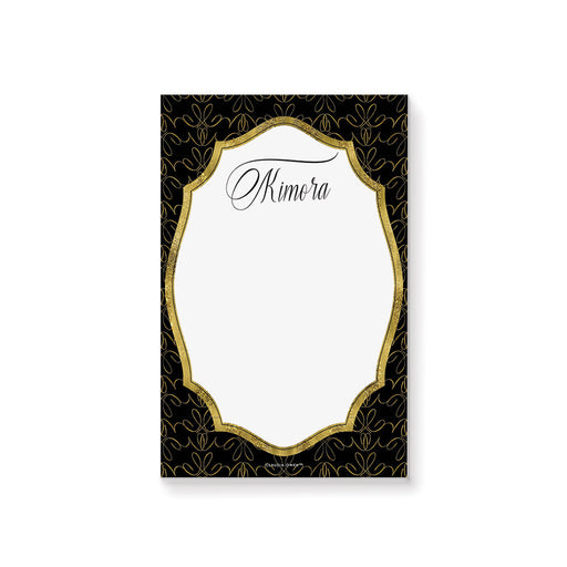 Personalized black and gold business notepad with an ornate patterned border, white writing area, and name in elegant script lettering