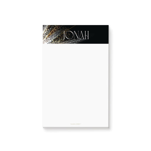 Personalized corporate gala notepad with a black header, sparkling gold accents, custom name, and a blank white writing area.