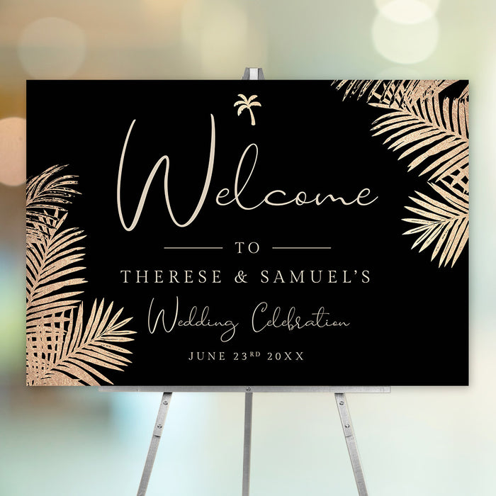 Personalized black and gold tropical wedding welcome sign with palm leaf border, custom couple’s names and wedding date