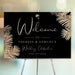 Personalized black and gold tropical wedding welcome sign with palm leaf border, custom couple’s names and wedding date