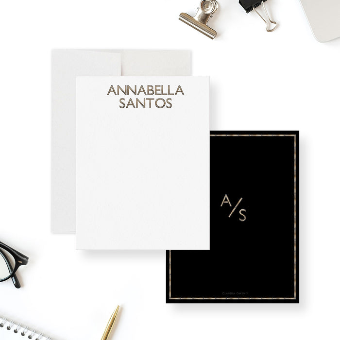 Monogram note cards with a printed gold effect name on the white front; matching initials and border on the black back.