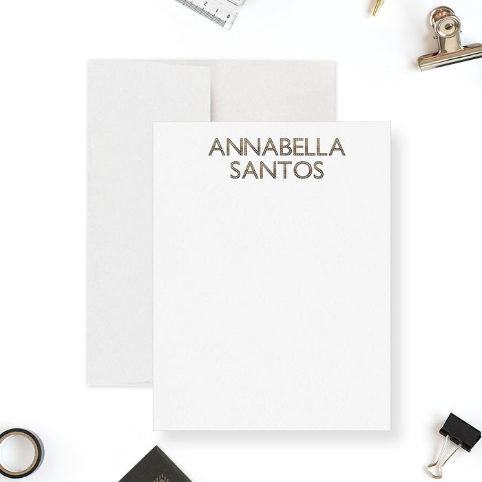Personalized monogram note card with a printed gold effect name at the top of the white writing area.