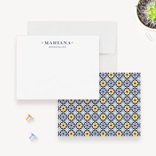 Personalized white note cards with a name on the front and a blue, yellow and white Mediterranean tile pattern on the reverse.