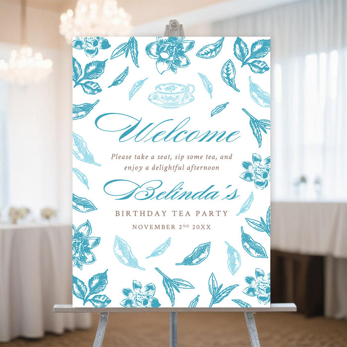 Personalized blue floral tea party welcome sign with teacup, botanical leaves, birthday name, and celebration date