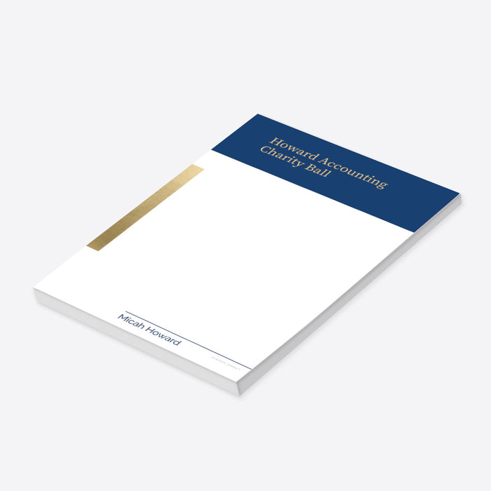 Personalized charity ball notepad with navy blue header, gold accent, event name, and custom name at the bottom.