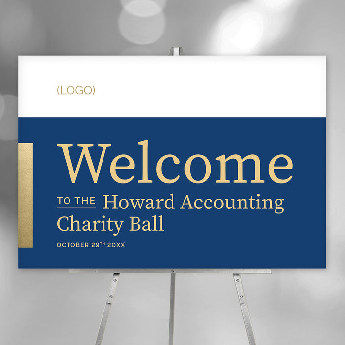 Blue and gold charity ball welcome sign on an easel with a logo area and personalized event details