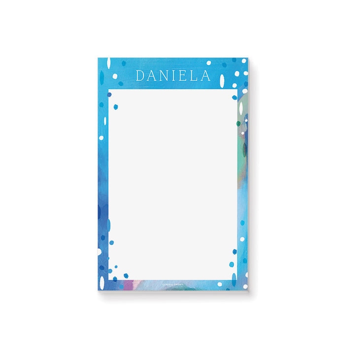 personalized blue painted notepad with custom name, cool abstract blue border, white writing space, and summer-inspired design