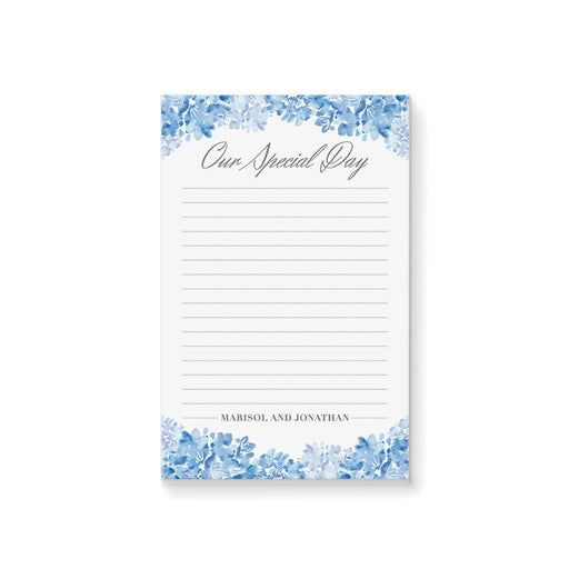 Personalized wedding notepad with blue watercolor hydrangeas, lined white writing area, Our Special Day heading, and couple’s names