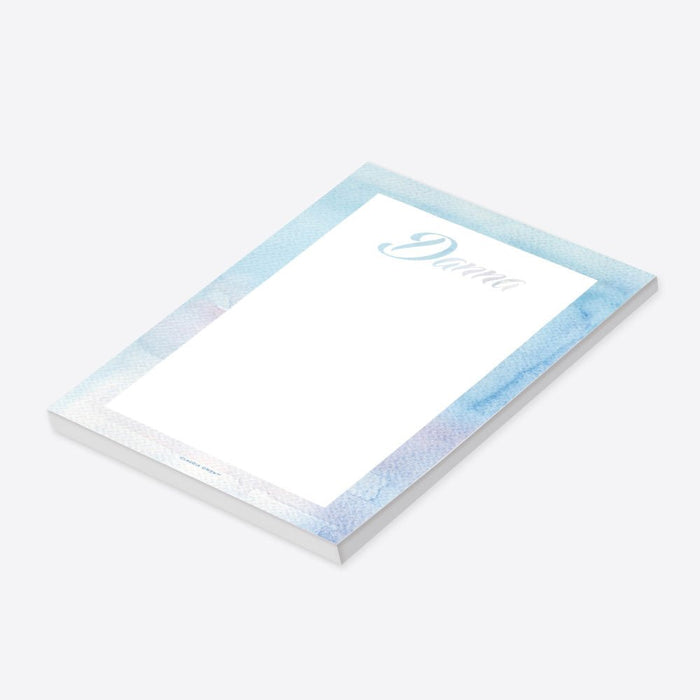personalized blue watercolor notepad with custom name in script lettering, soft watercolor border, and blank writing space-side