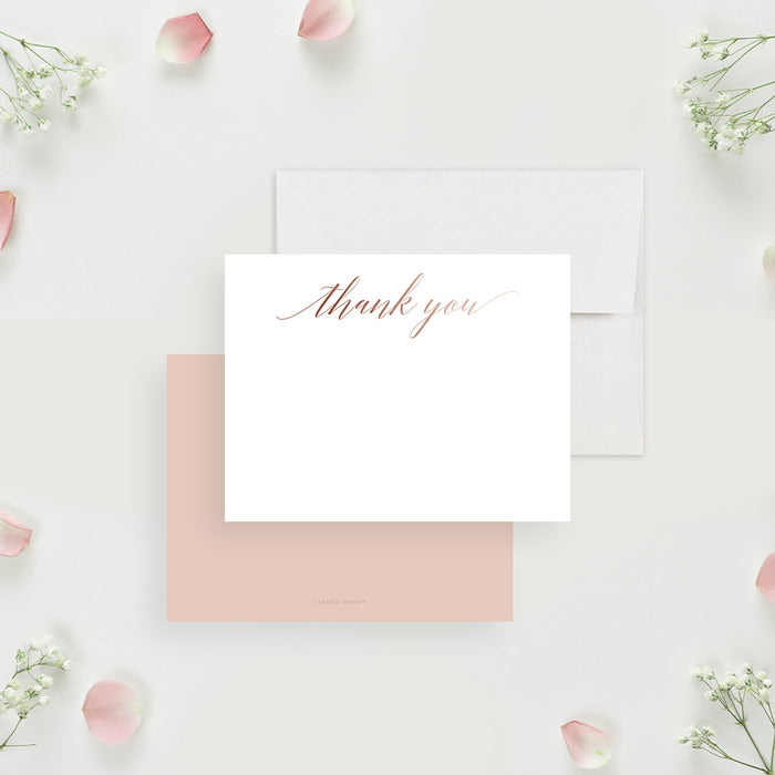 White wedding thank you note card with blush script, beside a solid blush pink back.