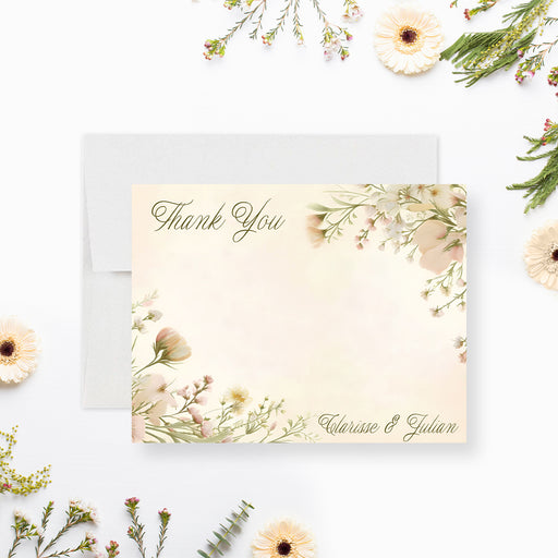 Front and back of personalized wedding thank you card with blush wildflowers, elegant Thank You script, writing space and the couple’s names-front