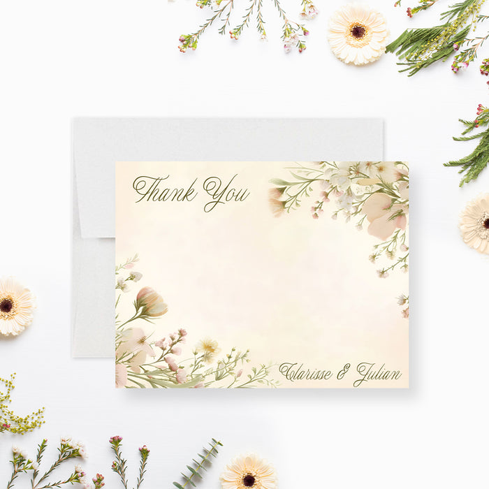Front and back of personalized wedding thank you card with blush wildflowers, elegant Thank You script, writing space and the couple’s names-front