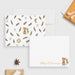 White personalized note card with a fox illustration, beside a back patterned with feathers, arrows and sun and moon motifs.
