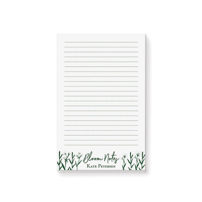 Personalized botanical notepad with a clean white writing area, green wildflowers, Bloom Notes wording, and custom name