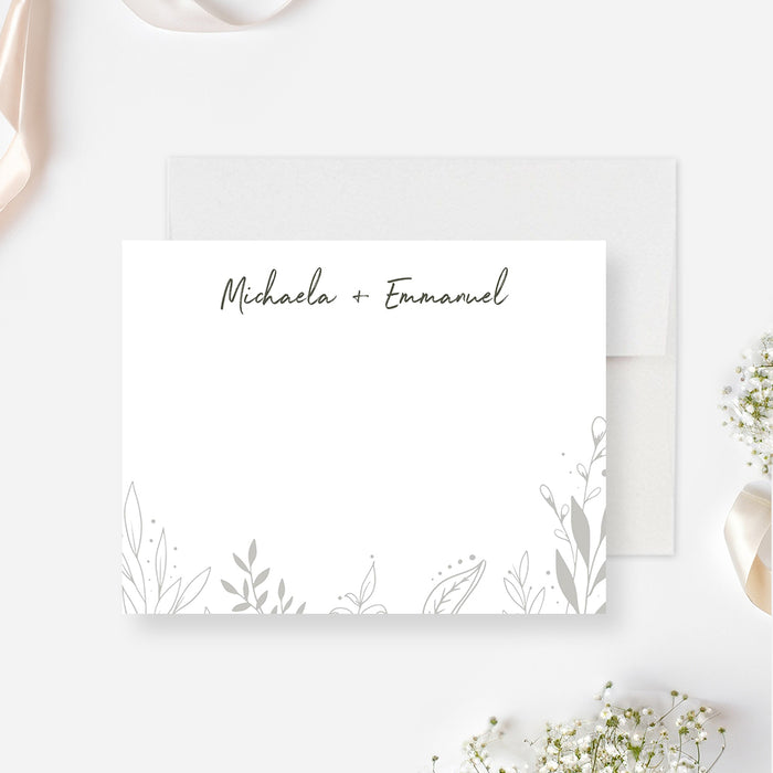 personalized botanical wedding thank you card with couple names, delicate foliage line art, white front, and moody green back design-front