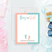 Personalized pink and blue gender reveal thank you card with Boy or Girl wording, baby footprints, parents-to-be’s names, and blank writing area-front