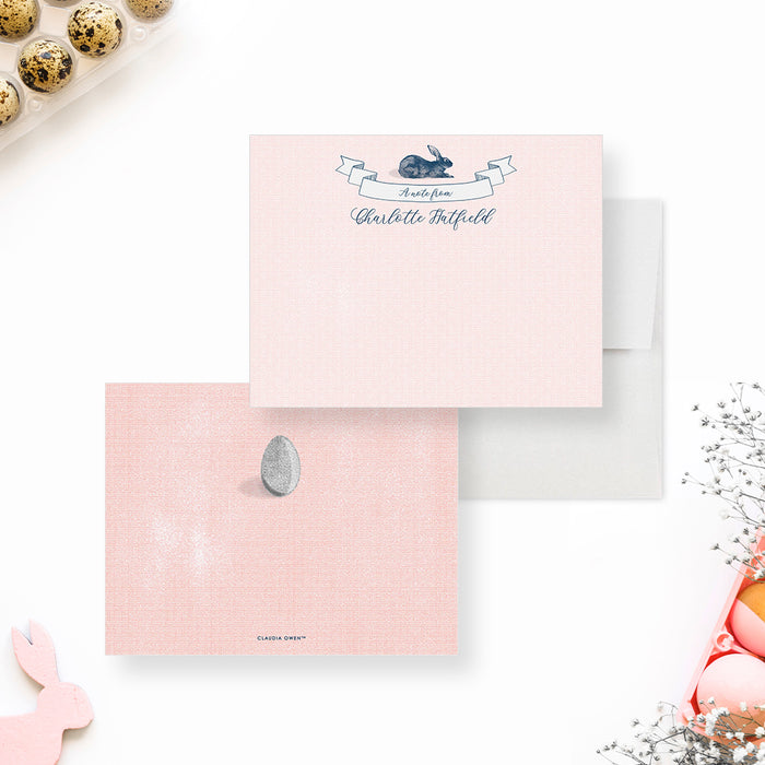 Personalized Bunny and Easter Egg Note Cards. Front and pink patterned back with an illustrated Easter egg shown with a white envelope.